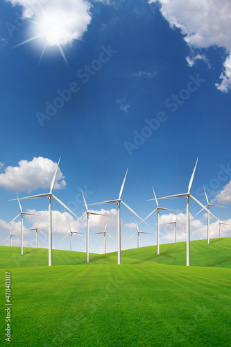 Wind turbine on green grass field
