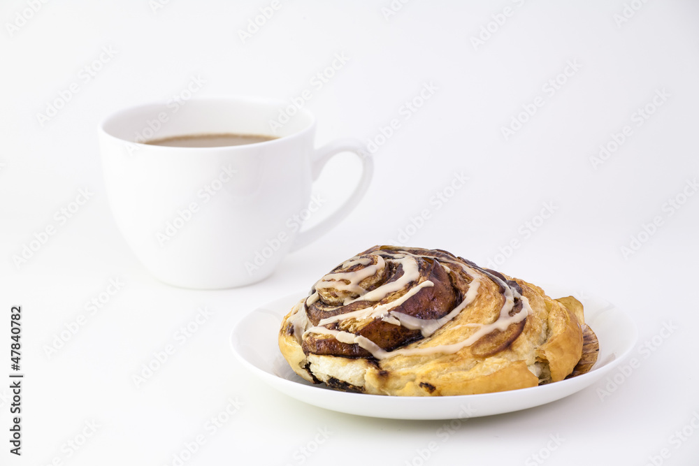 cinnamon bun and a cup of coffee cinnamon bun and a cup of coffee