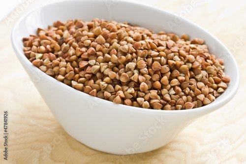 Dry buckwheat  in ceramic bowl