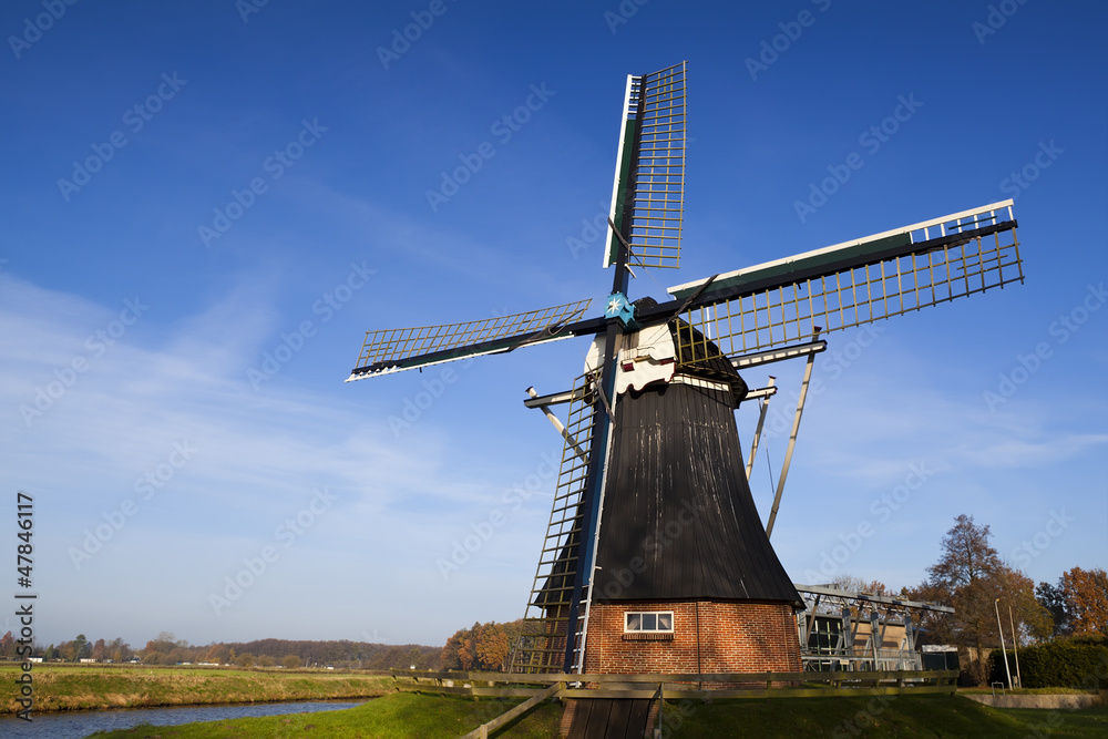 Dutch windmill over blue sky