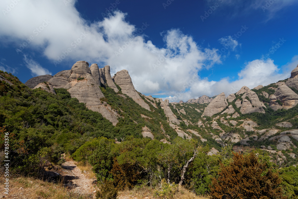 Montserrat is a mountain near Barcelona, in Catalonia