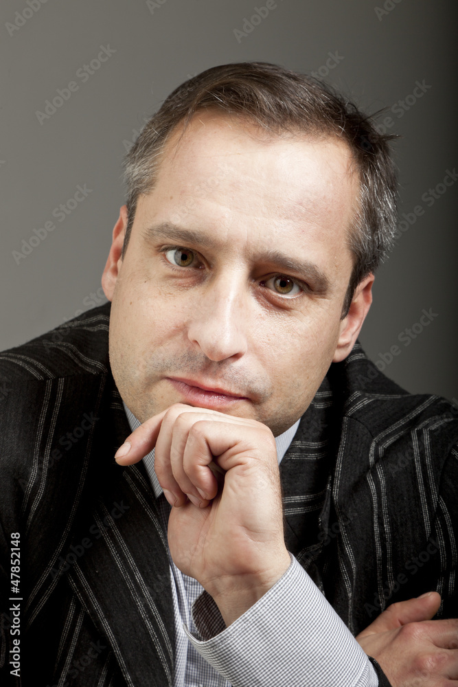 portrait of adult man isolated on dark background