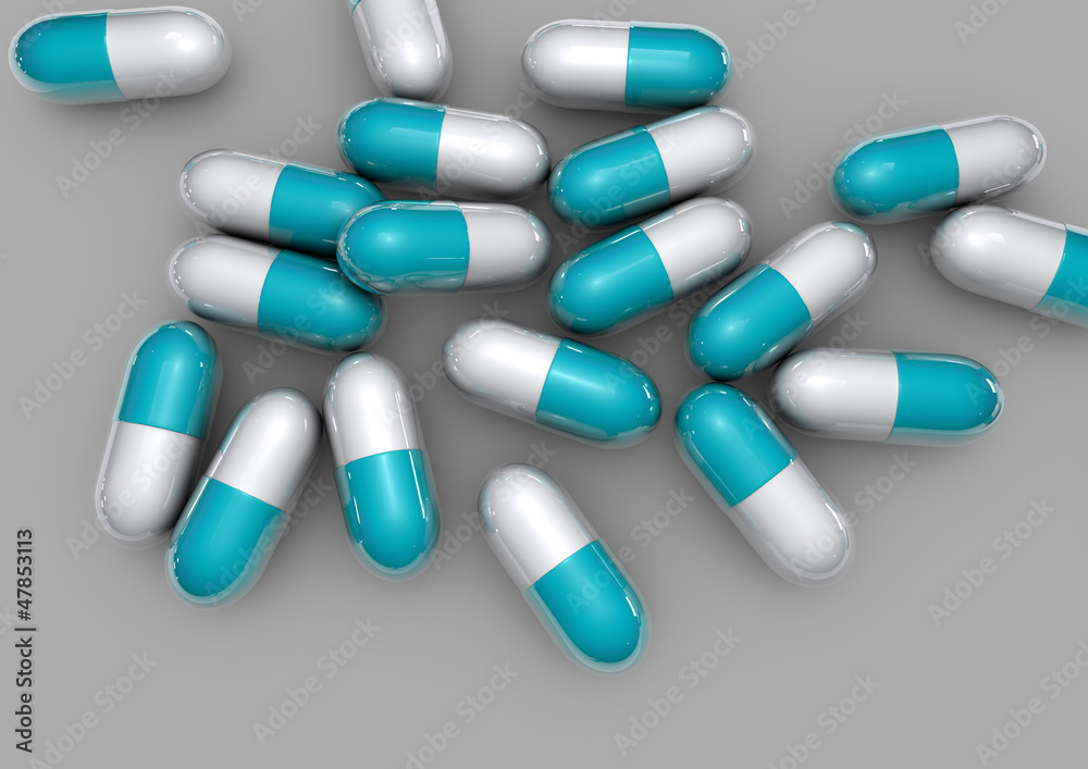 light blue pills isolated on grey