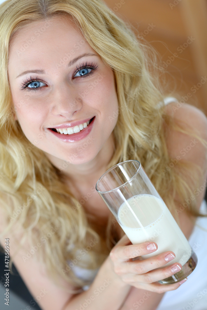 Beautiful woman holding glass of fresh milk Beautiful woman holding glass of fresh milk