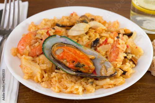 rice with mussels and shrimps on the plate