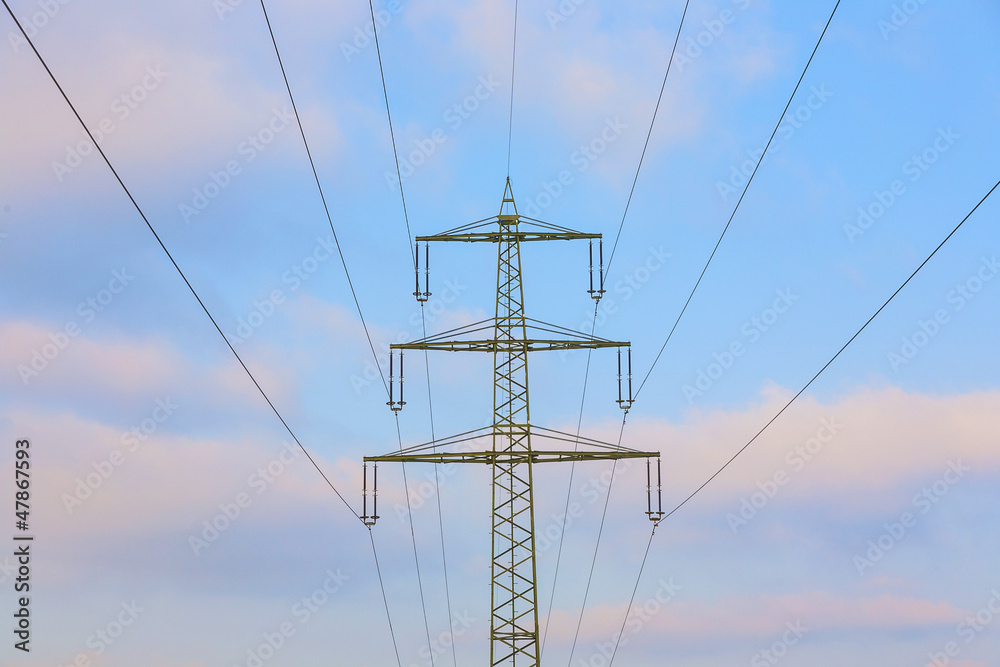 acres with snow in winter with electricity tower in sunset acres with snow in winter with electricity tower in sunset