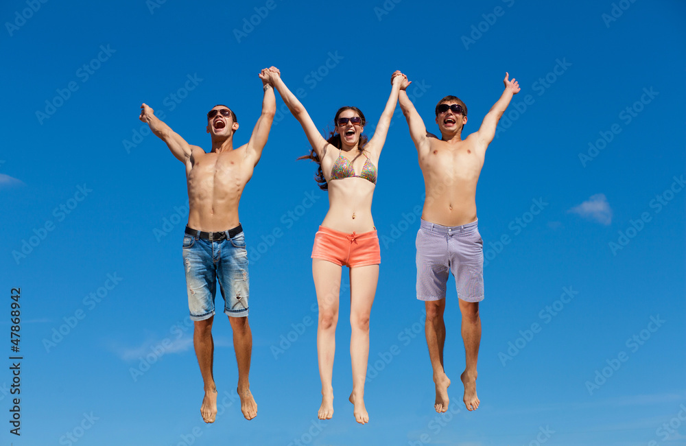 Obraz premium Group Of Friends Having Fun On Summer Beach