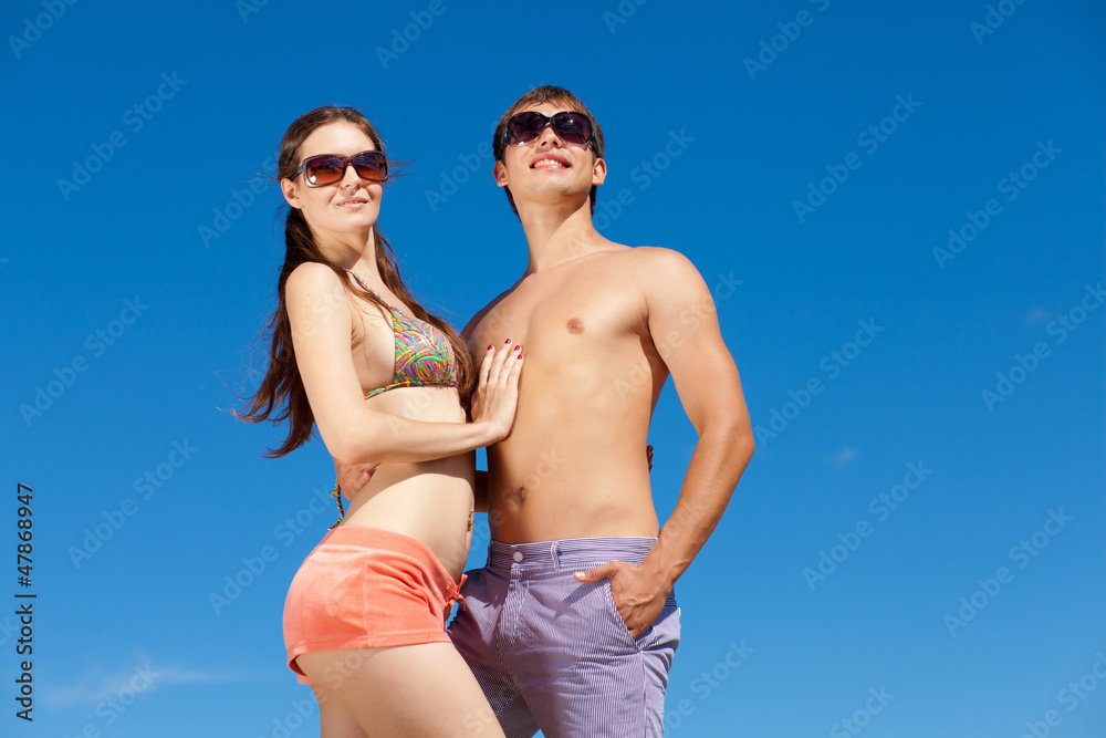 Happy Young Couple Together On The Beach Happy Young Couple Together On The Beach