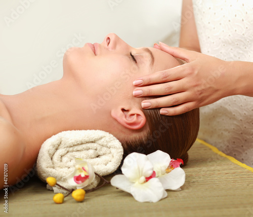 An attractive young woman receiving spa treatment