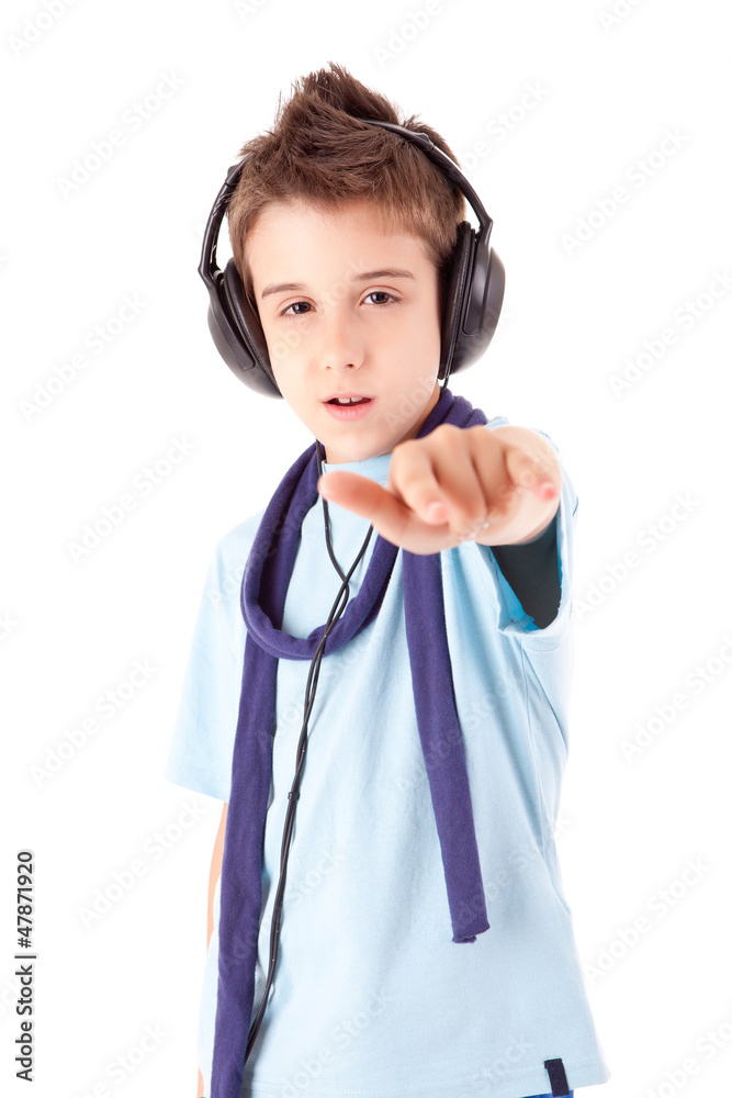 Cute little boy enjoying music using headphones Cute little boy enjoying music using headphones