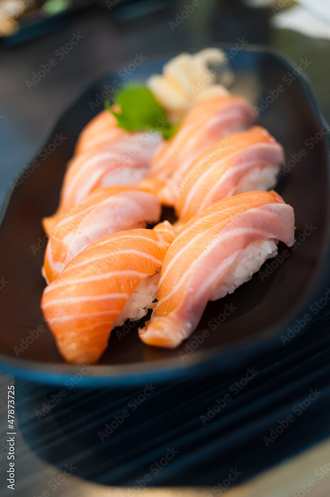 Close up of Salmon Sushi Set on Black Dish Close up of Salmon Sushi Set on Black Dish