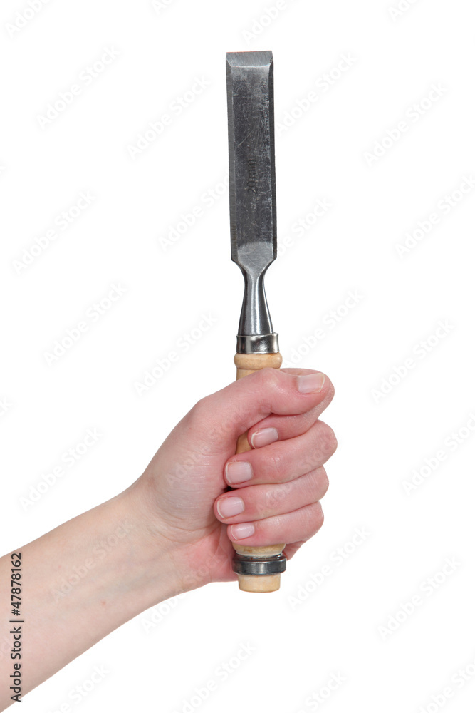 Hand holding chisel