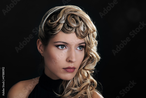 Facial portrait of a beautiful girl in a black dress