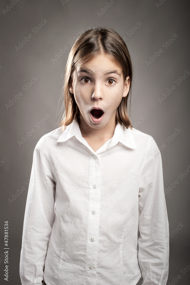 portrait of little girl with surprise expression portrait of little girl with surprise expression