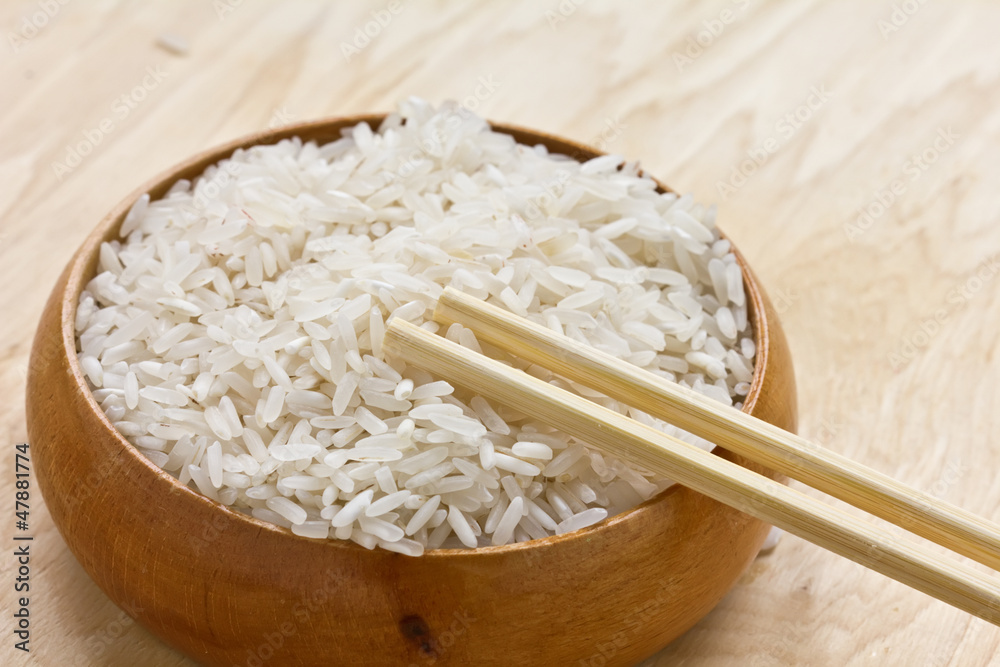 Rice in wooden bowl Rice in wooden bowl