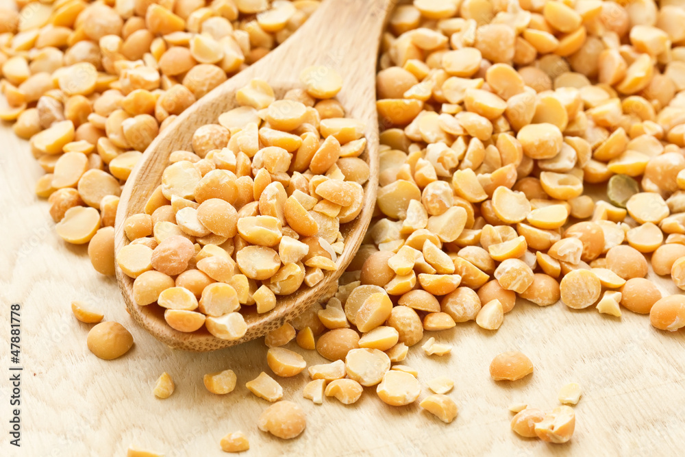 Dry peas on wooden background