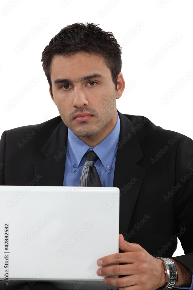 Businessman sat working at his desk Businessman sat working at his desk