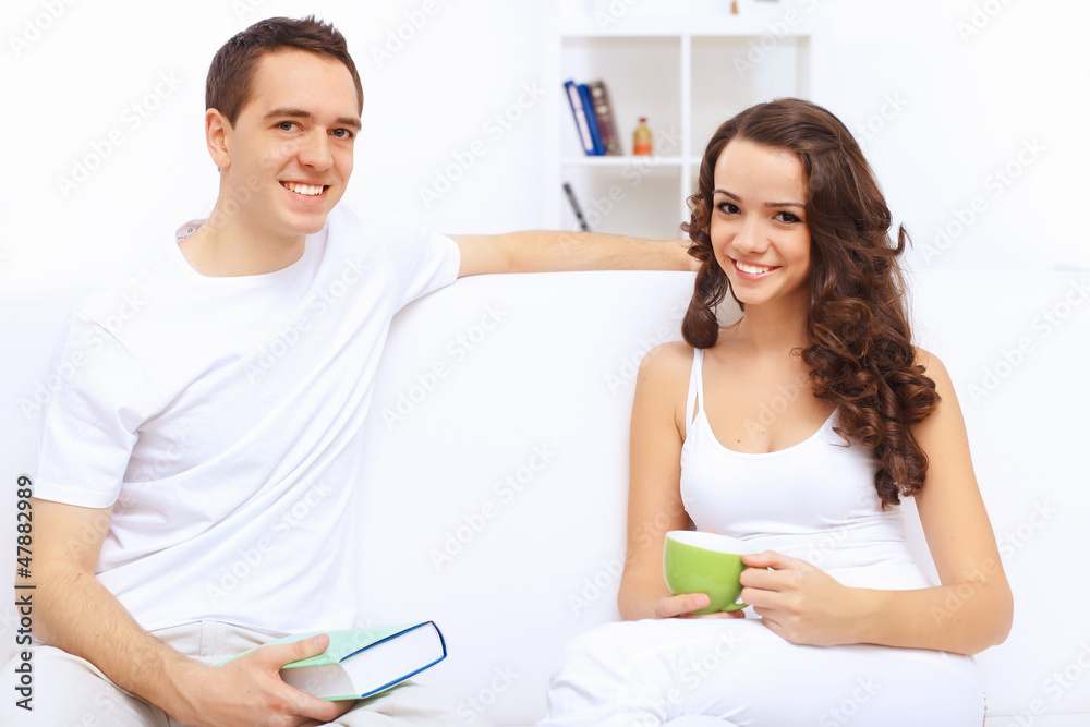 Young happy couple at hone together s