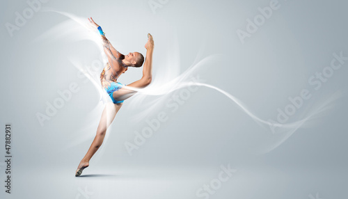 Fototapeta Naklejka Na Ścianę i Meble -  Young woman in gymnast suit posing