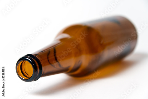 Brown beer bottle on a white background