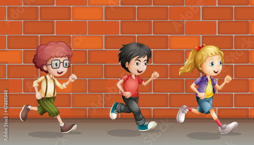 Two boys and a girl running