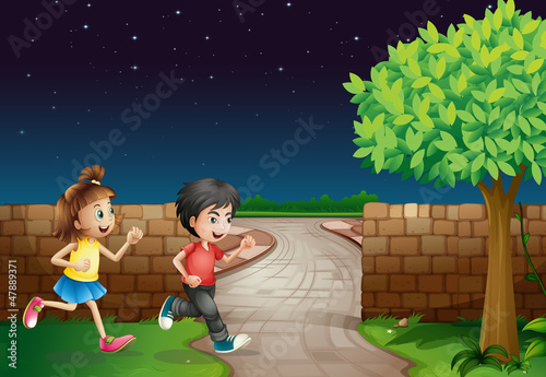 A running boy and a girl are