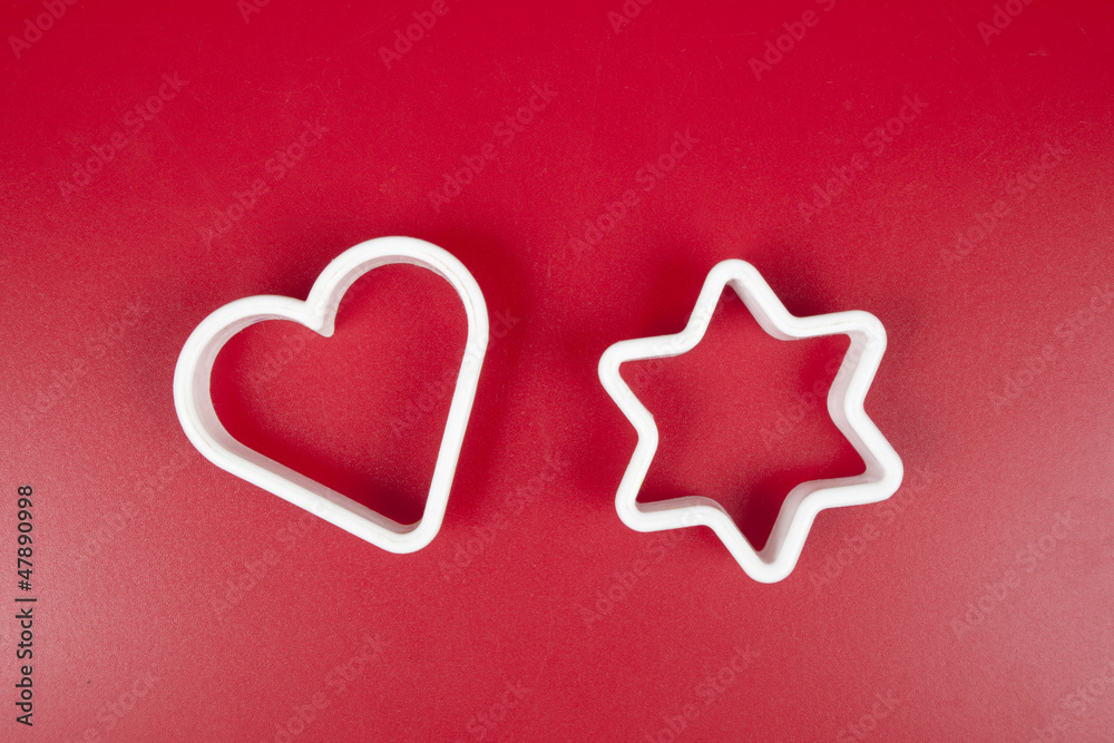 Obraz premium Forms for cookies on red background