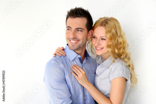 Portrait of cheerful couple on white background
