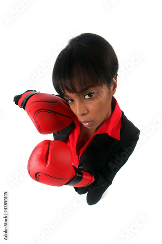 Angry woman with her punching gloves photo