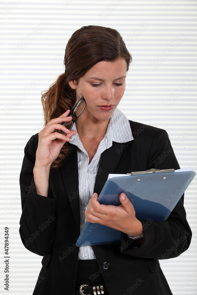 Woman holding clipboard