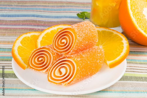 orange candy fruit on a plate