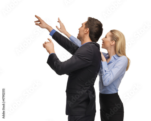 man and woman working with something imaginary