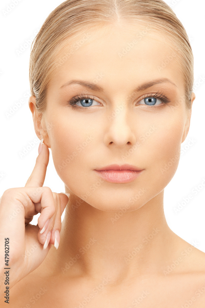 woman pointing to ear woman pointing to ear