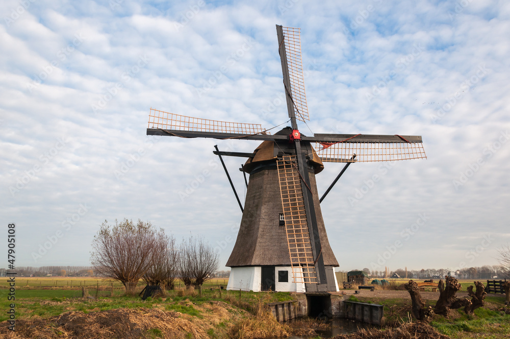 Historic windmill in a Dutch polder landscape Historic windmill in a Dutch polder landscape