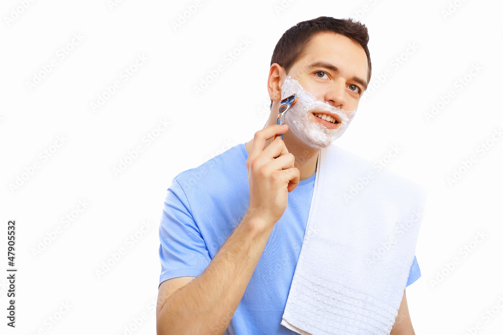 Young man at home shaving himself Young man at home shaving himself