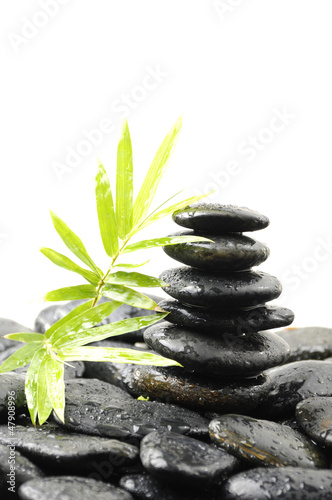 therapy stones with bamboo in water drops