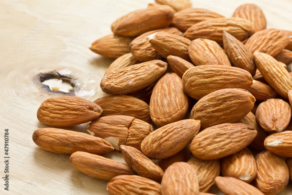 Almond on wooden background Almond on wooden background