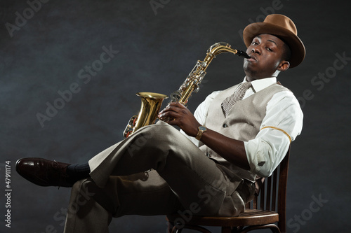Canvas Print Black american jazz saxophone player. Vintage. Studio shot.