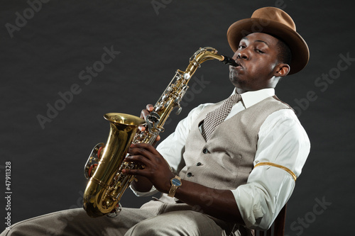 Canvas Print Black american jazz saxophone player. Vintage. Studio shot.