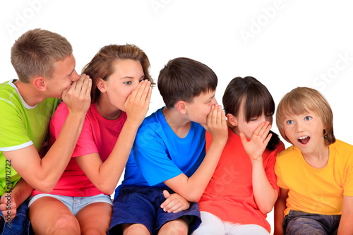 Happy children whispering