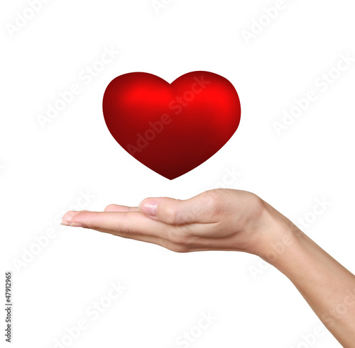 Hand holding red heart isolated on white background. Love and he