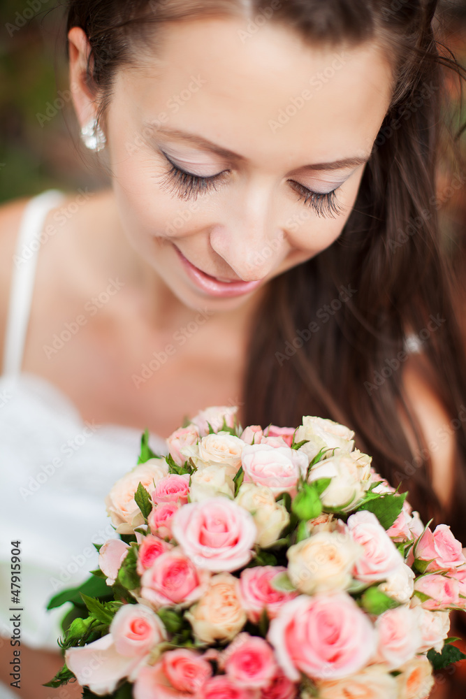 young brown-haired bride with wedding bouquet young brown-haired bride with wedding bouquet