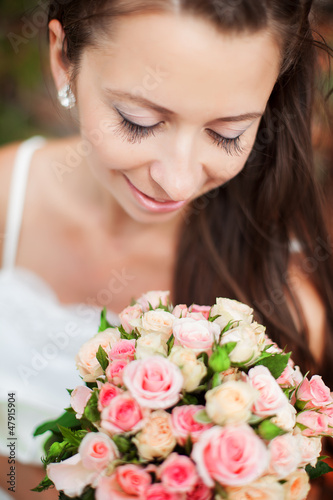 young brown-haired bride with wedding bouquet