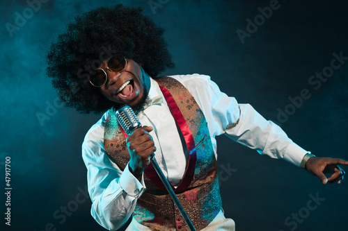 Photography Black american disco soul singer. Vintage. Studio shot.