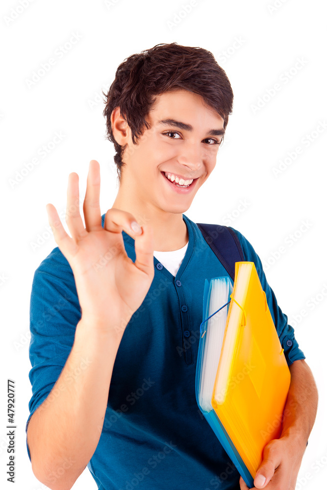 Young happy student showing Ok sign Young happy student showing Ok sign