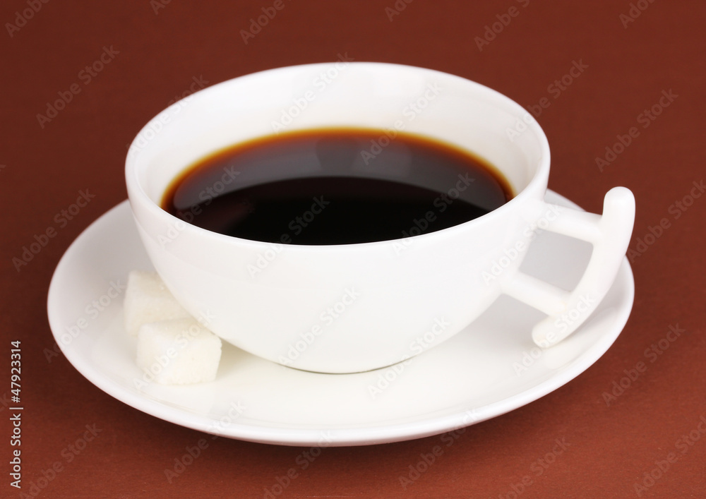 A cup of strong coffee on brown background A cup of strong coffee on brown background
