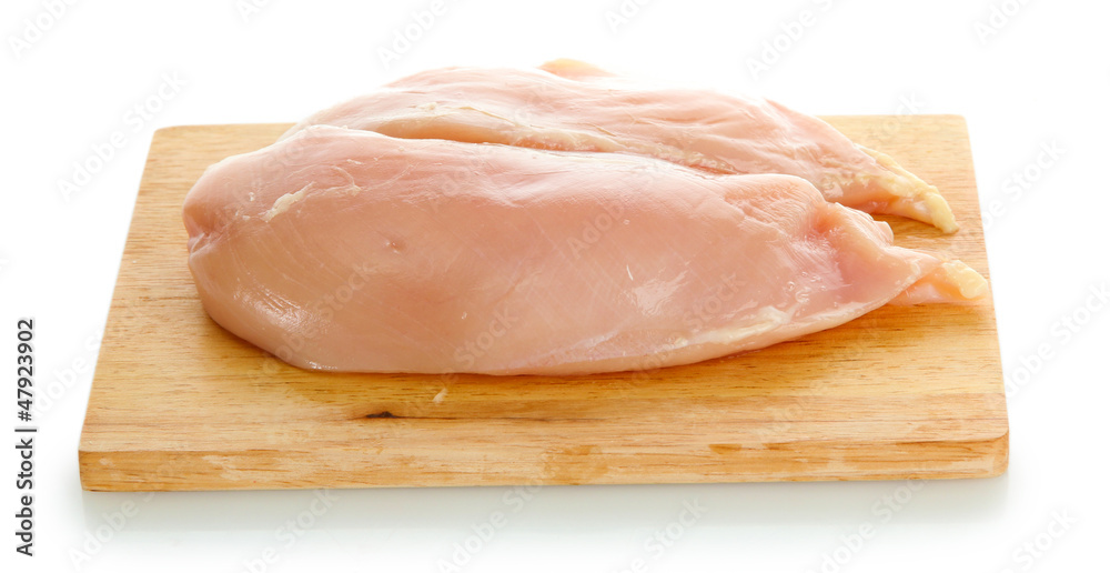 raw chicken meat on cutting board, isolated on white raw chicken meat on cutting board, isolated on white
