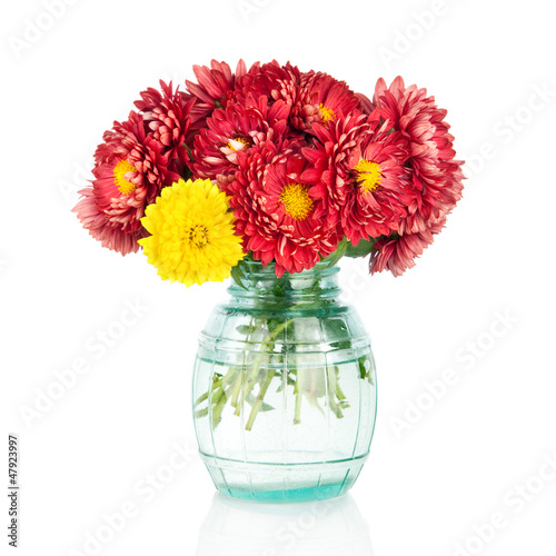 Huge bunch of yellow and red autumn flowers in vase