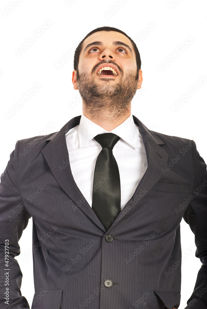 Amazed business man looking up Amazed business man looking up