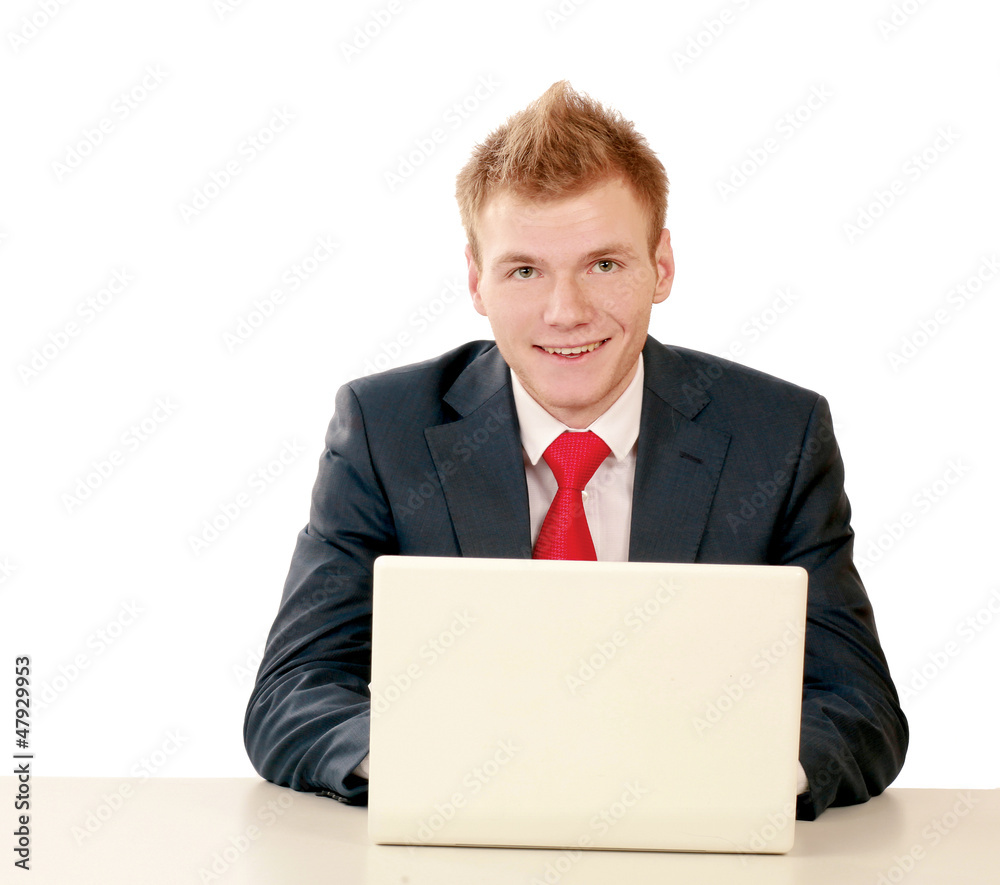 Young businessman at his workplace, isolated on white background Young businessman at his workplace, isolated on white background
